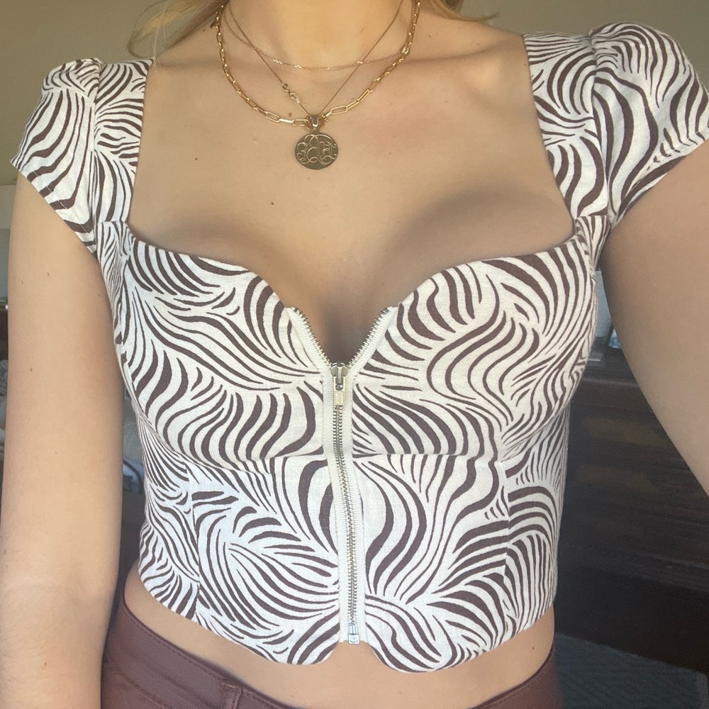 reformation zipper short sleeve top zebra print